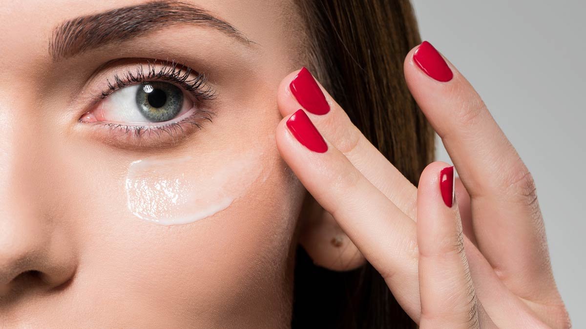 woman applying glycolic acid cream